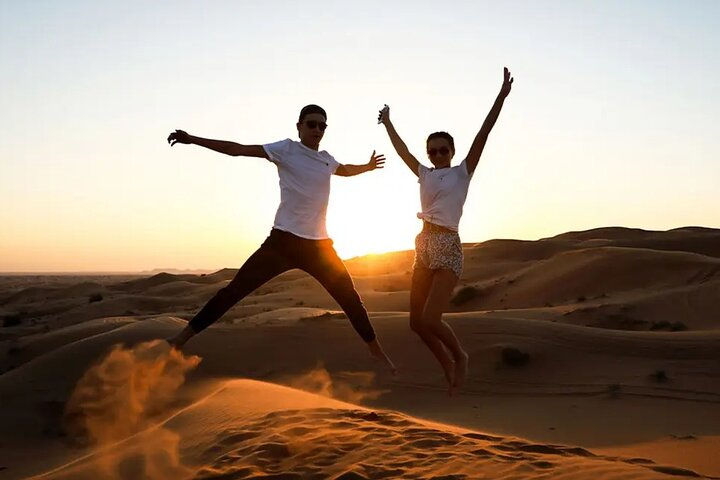 Experience the magic of the desert at sunrise where soft sands and stunning vistas set the stage for unforgettable moments filled with joy and adventure.